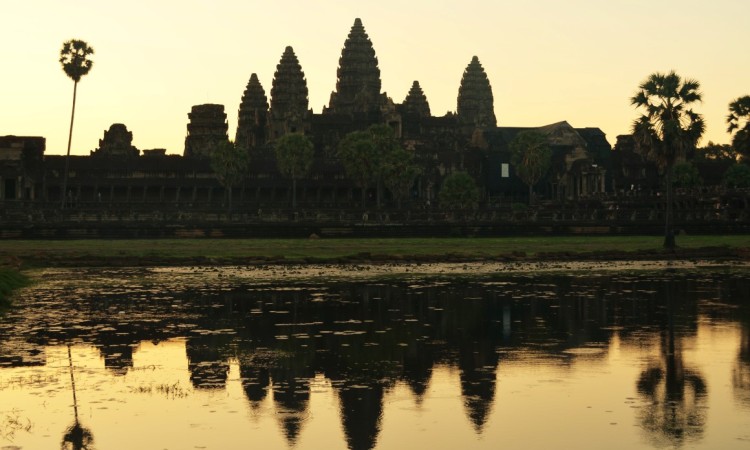 Angkor Wat at dawn. Arrive early to get yourself a nice spot by the reservoir to see the reflection of Angkor Wat as the sun comes up!